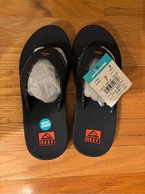 Reef Navy Flip Flops with Orange Logo Accents